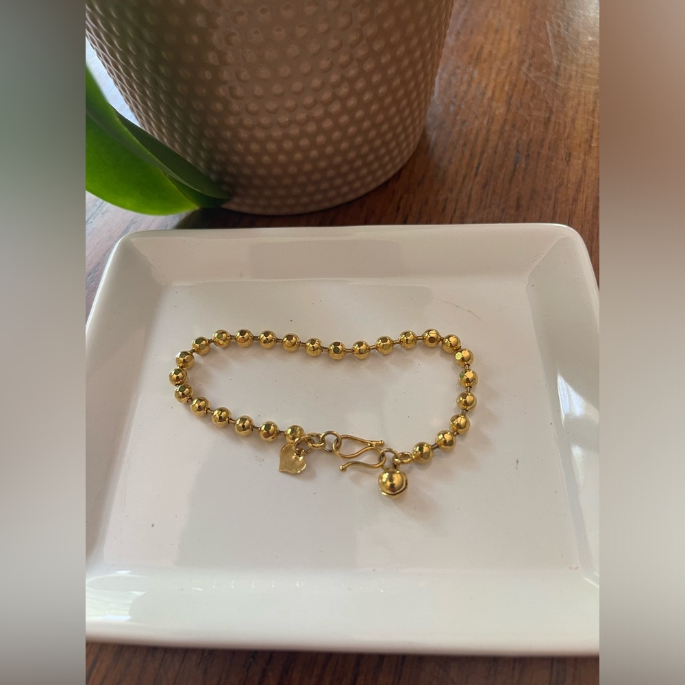 Gold color bracelet 8” long including clasp.